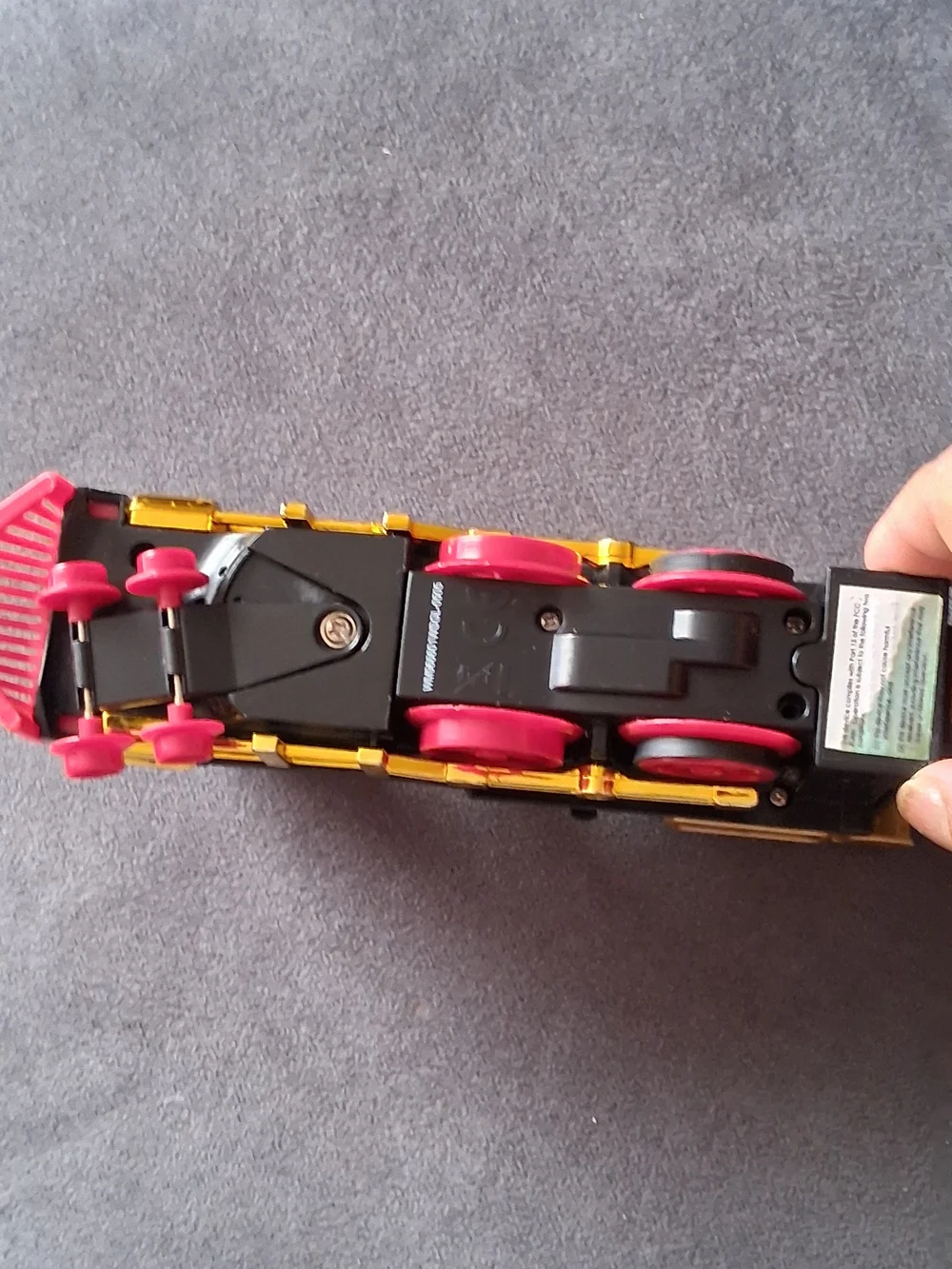 Vintage Style Black and Gold Toy Train with Red Accents